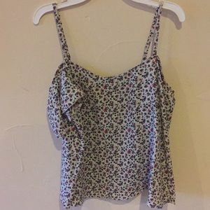 Floral print spaghetti strap with open sleeves.